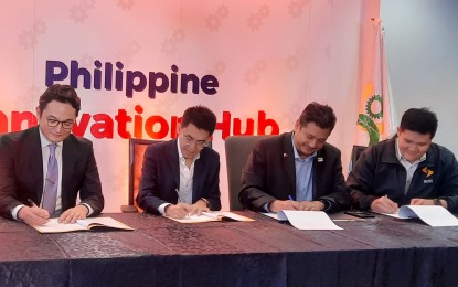 <p><strong>SOLX PARTNERSHIP</strong>. National Development Company (NDC)-managed Startup Venture Fund (SVF) and Real Tech Holdings pour in a total of PHP22 million in Filipino startup SolX Technologies, Inc. Signing the partnership document are (from left to right) Real Tech director Louis Christian Murayama, SolX CEO Sergius Santos, NDC General Manager Anton Mauricio, and SolX COO Matt Levin Tan at the NDC Innovation Hub in Makati City on Tuesday (Oct. 24, 2023). <em>(PNA photo by Kris Crismundo)</em></p>