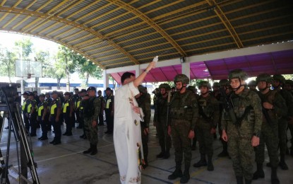 <p><strong>SEND-OFF</strong>. Rev. Fr. Alfonso Alojipan, Jr. leads the blessing of troops and resources during the send-off ceremony on Tuesday (Oct. 24, 2023). Antique Provincial Election Supervisor Lawyer Salud Milagros Villanueva, in her message, said the concerted effort of more than 2,000 security personnel will try to ensure the peaceful and credible Barangay and Sangguniang Kabataan Election (BSKE) 2023 in Antique. (<em>PNA by Annabel Consuelo J. Petinglay</em>)</p>