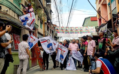 <p><strong>OPERATION BAKLAS</strong>. Commission on Elections Chairperson George Erwin Garcia (center) leads "Operation Baklas" (dismantling) of illegal campaign materials of Barangay and Sangguniang Kabataan Elections candidates in Maricaban, Pasay City on Oct. 24, 2023. The common violations are hanging the campaign posters on electric posts, trees and wires; sizes bigger than the required sizes; and placing campaign materials outside common poster areas. <em>(PNA photo by Yancy Lim)</em></p>