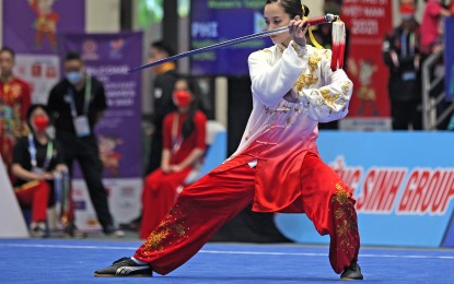 <p><strong>FINE FORM.</strong> Wushu artist Agatha Wong performs during the Cambodia Southeast Games on May 15, 2022. Wong pocketed the silver medal in the women's Taolu Taijiquan and Taijijian competition in the World Combat Games in Riyadh, Saudi Arabia on Monday (Oct. 23, 2023.) <em>(PSC Media Pool photo)</em></p>