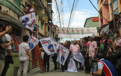 <p><strong>CRACKDOWN. </strong>Commission on Elections Chairperson George Erwin Garcia leads the "Operation Baklas" (dismantling) of illegal campaign materials of Barangay and Sangguniang Kabataan Elections candidates in Maricaban, Pasay City, on Oct. 24, 2023. The poll body on Tuesday (March 5, 2024) said it is bent on enforcing a ban against premature campaigning for next year's midterm elections. <em>(PNA file photo by Yancy Lim)</em></p>