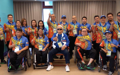 <p><strong>CHESS TEAM VISIT.</strong> Philippine Paralympic Committee president Mike Barredo (center in dark glasses, seated) visits the national para chess team before they see action in the sixth round of the 4th Asian Para Games chess tournament standard event in Hangzhou, China on Wednesday (Oct. 25, 2023). The Filipino wood pushers inched closer to delivering the country another potential golden windfall.<em> (Photo courtesy of PSC Media Pool)</em></p>