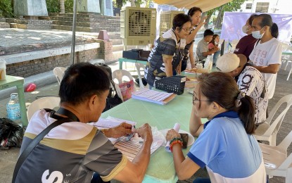 <p><strong>LOW-COST HOUSING</strong>. Some residents in Ilocos Norte on Thursday (Oct. 26, 2023) sign up to avail of the affordable housing project expected to rise in Barangay Talingaan, Laoag City under the government’s Pambansang Pabahay para sa Pilipino (4PH) program. The groundbreaking of the project is eyed in December this year. <em>(Photo by Leilanie G. Adriano)</em></p>