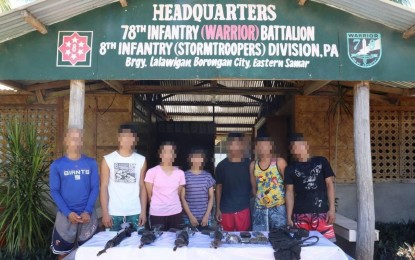 <p><strong>LEAVING NPA.</strong> The seven fighters of the New People's Army (NPA) who surrendered to the military in this October 17 photo.  At least 12 active armed rebels have surrendered to the military in Eastern Visayas since the launch of an initiative that links government forces to families of rebels. <em>(Photo courtesy of Philippine Army)</em></p>