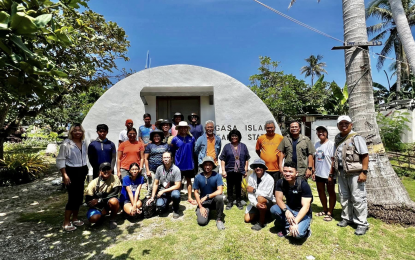 <p><strong>WATER MANAGEMENT PROJECT.</strong> Department of Environment and Natural Resources Secretary Maria Antonia Yulo-Loyzaga (center) and her team visit Kalayaan municipality in the West Philippine Sea on Oct. 23, 2023. She told local officials that an effective management system would be built in the town's main island of Pag-asa to ensure good sanitation and availability of potable water. <em>(Photo courtesy of DENR)</em></p>