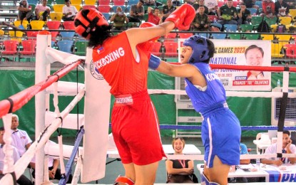 <p><strong>WINNER.</strong> Betty May Churping of Philippine Army (right) against Camille Joy Sanchez of Philippine Air Force during the female 52kg final in the Reserves Officer Training Corps (ROTC) Games National Championships kickboxing competition held at the Rizal Memorial Sports Complex on Friday (Oct. 27, 2023). Churping, a student from University of Baguio, won the gold medal by points. <em>(PSC Media pool) </em></p>