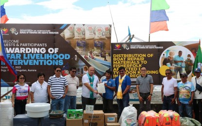<p style="text-align: left;"><strong>LIVELIHOOD AID.</strong> The Department of Agriculture-Bureau of Fisheries and Aquatic Resources (DA-BFAR) led by National Director Demosthenes Escoto (5th from left) and Regional Director Wilfredo Cruz (7th from left) distribute livelihood assistance to the fisherfolk in Dingalan, Aurora on Friday (Oct. 27, 2023). The beneficiaries, whose source of livelihood was adversely affected by Super Typhoon Karding last year, received a total of PHP20 million worth of assistance including boat repair materials, fishing gear and other paraphernalia.<em> (Photo courtesy of BFAR-Central Luzon)</em></p>