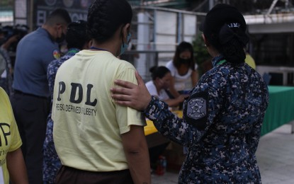 <p><strong>VOTING IN JAIL.</strong> A female person deprived of liberty (PDL) is escorted by a jail guard in the special polling precinct at the Manila City Jail in Sta. Cruz, Manila on Monday (Oct. 30, 2023). Around 31,000 PDLs nationwide are expected to exercise their right to vote in the Barangay and Sangguniang Kabataan elections. <em>(PNA photo by Ben Pulta)</em></p>