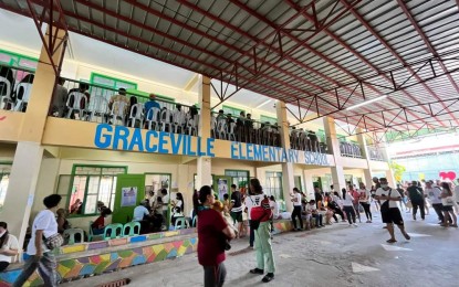 <p><strong>'NO' WINS. </strong>Voters troop to the Graceville Elementary School in Barangay Graceville, San Jose del Monte City for the Barangay and Sangguniang Kabataan Elections and the plebiscite on the conversion of SJDM into a highly urbanized city on Oct. 30, 2023. The city will not be converted into an HUC as over 800,000 Bulacan voters rejected the measure in Monday's plebisicite. <em>(Photo courtesy of SJDM Public Information Office)</em></p>
<p> </p>