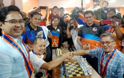<p><strong>SPECIAL GUEST.</strong> Asia's First Grandmaster Eugene Torre (seated right) shakes hands with Misamis Occidental Governor Henry Oaminal Sr. during the opening ceremony of the Asenso Misamis Occidental National Open Chess at the Aya Hotel & Residences in Clarin town last July. The best players from Visayas and Mindanao will see action in the first Governor Henry Oaminal 7-in-1 Chess Festival from Nov. 10-12 at the Ozamiz City Auditorium in Misamis Occidental as part of the province's 94th founding anniversary celebration. <em>(Contributed photo)</em></p>