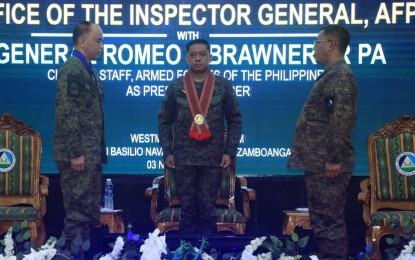 <p><strong>ASSUMING NEW POSTS.</strong> AFP chief Gen. Romeo Brawner Jr. (center) officiates the assumption of Lt. Gen. William Gonzales (left) as the new head of Western Mindanao Command and Maj. Gen. Steve Crespillo (right) as the new AFP Inspector General during the joint change of command and chief of office ceremony at Camp Navarro, Zamboanga City on Friday (Nov. 3, 2023). The AFP said the joint change of command and chief of office rites are a symbol of continuity within the military organization. <em>(Photo courtesy of the AFP)</em></p>