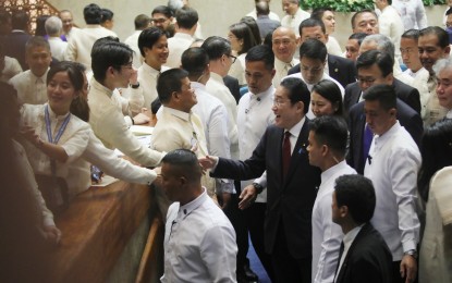 <p><strong>PARTNERS. </strong>Japan Prime Minister Fumio Kishida (center) greets lawmakers during the special joint session of Congress at Batasang Pambansa in Quezon City on Saturday (Nov. 4, 2023). Kishida vowed Japan's renewed commitment to defend a free and open Indo-Pacific. <em> (PNA photo by Avito C. Dalan)</em></p>