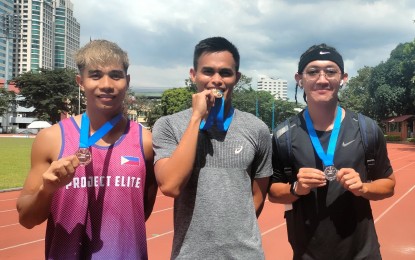 <p><strong>TOP THREE.</strong> Navyman Anfernee Lopena (center) clocked 10.47 seconds to win the men's 100 meters in the Elite/Open division of the 2023 Cel Logistics, Inc. Weekly Relay Series Finals at Philsports track and field stadium in Pasig City on Saturday (Nov. 4, 2023). Also in photo are silver medalist Ahlryan Labita of University of the Philippines (right) and bronze medalist Vince Jayson Buhayan of Mapua. <em>(PNA photo by Jean Malanum)</em></p>