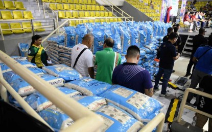 <p><strong>CARD PROGRAM</strong>. Rice assistance is distributed to beneficiaries in Biñan, Laguna in November 2023. Around 83,000 beneficiaries also stand to get aid from Eastern Visayas from April 5 to 7, 2024 under the same program. <em>(File photo)</em></p>