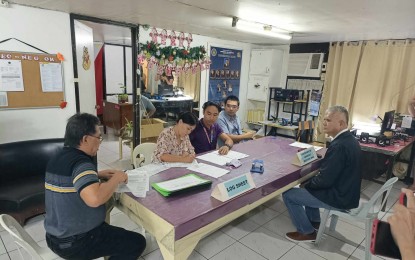 <p><strong>COC FILING</strong>. Retired Navy Col. Rey Lopez (right) files his certificate of candidacy for the third congressional district seat of Negros Oriental on Tuesday (Nov. 7, 2023) at the Commission on Elections provincial office. A special election for the third district seat is set on Dec. 9, 2023, after it was deemed vacated following the expulsion of former Rep. Arnolfo Teves Jr. <em>(Photo courtesy of Comelec-Negros Oriental)</em></p>