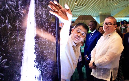 <p><strong>DEVELOPMENT PROJECTS.</strong> The Department of Agriculture opens an exhibit showcasing various World Bank-funded projects at Novotel Manila Araneta City in Cubao, Quezon City on Monday (Nov. 6, 2023). Agriculture Secretary Francisco Tiu Laurel Jr. (right) and Assistant Secretary for Operations and Philippine Rural Development Project National Project Director Arnel de Mesa are joined in the opening ceremony by World Bank Country Director for Brunei, Malaysia, Thailand, and the Philippines Dr. Ndiamé Diop (center, in suit). <em>(PNA photo by Robert Oswald P. Alfiler)</em></p>