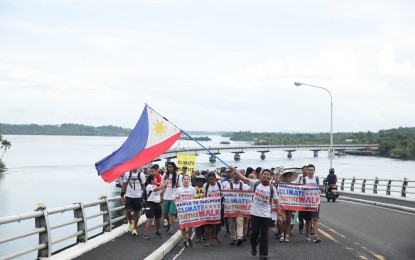 <p><strong>WALK FOR NATURE.</strong> After a month-long walk from Metro Manila, an environmental group composed of 28 people, arrive in this city on Wednesday (Nov. 8, 2023), in time for the 10th-year commemoration of the onslaught of Super Typhoon Yolanda. The group called for the active participation of the government in efforts to mitigate the effects of climate change. <em>(Photo courtesy of Greenpeace)</em></p>