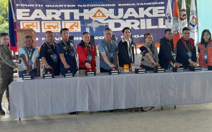<p><strong>QUAKE DRILL.</strong> Casiguran Mayor Roynaldo  Soriano (6th from left)  leads the ceremonial pressing of the button to signal the start of the conduct of the 4th  Quarter Nationwide Simultaneous Earthquake Drill  (NSED) in Barangay Esteves, Casiguran, Aurora on Thursday (Nov. 9, 2023).  Casiguran was chosen as the ceremonial site of quake drill in line with the observance of World Tsunami Day as the municipality experienced a tsunami after a 7.3 magnitude quake in 1968. <em>(Photo by Jason de Asis)</em></p>