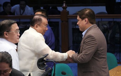 <p><strong>APPROVED.</strong> Senate President Juan Miguel Zubiri (right) on Thursday (Nov. 9, 2023) shakes hands with Executive Secretary Lucas Bersamin (left) after the 2024 proposed budgets of the Office of the President and Presidential Management Staff passed the Senate plenary debates. Zubiri cited the OP's "very detailed" report on how the OP's PHP2.3 billion intelligence funds was used. <em>(PNA photo by Avito Dalan)</em></p>