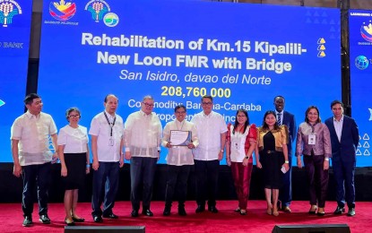 <p><strong>GOOD TO GO.</strong> Davao del Norte province officials receive the certificate of eligibility for a proposed subproject worth PHP208.8 million under the Philippine Rural Development Project (PRDP) Scale-Up program, in Quezon City on Nov. 6, 2023. The project involves the rehabilitation of Km.15 Kipalili-New Loon farm-to-market road with a bridge in San Isidro town. <em>(Photo from DA-11)</em></p>