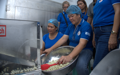 <p><strong>LOW-COST BABY FOOD.</strong> Members of the Barangay Nutrition Scholars Association of Odiongan, Romblon work at the Complementary Food Production Facility on Friday (Nov. 10, 2023), churning out "Nutri Gold Curls" from a machine provided by the Food and Nutrition Research Institute.  Department of Science and Technology officials said the facility will help address kids' malnutrition in the town and beyond. <em>(Photo courtesy of DOST-Romblon Director Marcelina Servañez)</em></p>