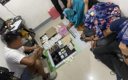 <p><strong>BUSTED.</strong> An agent of the Philippine Drug Enforcement Agency (PDEA) accounts for illegal drug evidence seized in a buy-bust in Bacoor City, Cavite on Thursday night (Nov. 9, 2023). The operation netted a total of 3.5 kg. of suspected shabu with an estimated street value of PHP23.8 million from four suspects.<em> (Photo courtesy of PDEA)</em></p>