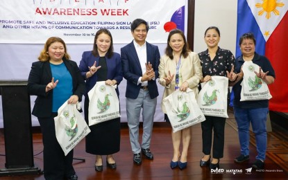 <p><strong>NATIONAL DEAF AWARENESS WEEK</strong>. The Department of Education holds the kickoff celebration of the National Deaf Awareness Week at the Bulwagang Romualdez of the Komisyon sa Wikang Filipino in Manila on Friday (Nov. 10, 2023). Commissioner IV Benjamin Mendillo (center) of the Commission on the Filipino Language graced the event that promotes the Filipino Sign Language and other inclusive communication processes. <em>(Photo courtesy of DepEd) </em></p>