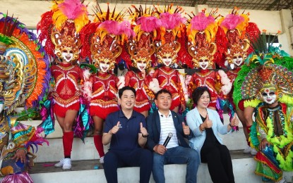 <p><strong>CULTURAL COLLABORATION.</strong> Visiting legislators from Andong City, South Korea pose with the MassKara Festival dancers of Barangay Granada at the Paglaum Sports Complex in Bacolod City on Thursday (Nov. 9, 2023). In a statement on Friday (Nov. 10, 2023), Mayor Alfredo Abelardo Benitez expressed hope that their visit would pave the way for a more colorful collaboration between the two cities. (<em>Photo from Albee Benitez Facebook page</em>)</p>