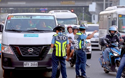 <p><strong>ANTI-COLORUM OPS.</strong> Personnel of the central office of the Land Transportation Office (LTO) conduct an operation against “colorum” or unregistered public utility vehicles along Aurora Boulevard in Quezon City on Nov. 9, 2023. LTO chief Assistant Secretary Vigor Mendoza II has ordered the policy to be relaxed for the rest of December “in the spirit of the Yuletide season.” <em>(PNA photo by Joey O. Razon)</em></p>