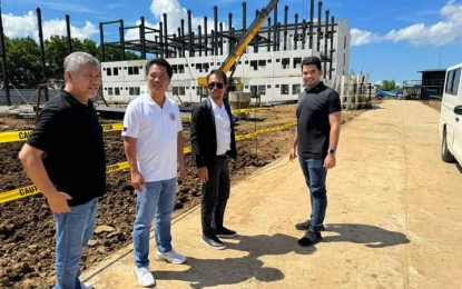 <p><strong>4PH PROJECT.</strong> Secretary Jose Rizalino Acuzar (2nd from right) of the Department of Human Settlements and Urban Development, with Bacolod City Mayor Alfredo Abelardo Benitez (2nd from left), Councilor Vladimir Gonzales (left), and Scheirman Construction Consolidated Inc. president and chief executive officer William Russell Scheirman Jr., conducts an ocular inspection of the construction of the first building of the Yuhum Residences in Barangay Vista Alegre on Friday (Nov. 10, 2023). Implemented under the Pambansang Pabahay para sa Pilipino (4PH) Program, the initial set of housing units is ready for awarding to 288 buyer-beneficiaries next month. (<em>Photo courtesy of Bacolod City PIO</em>)</p>