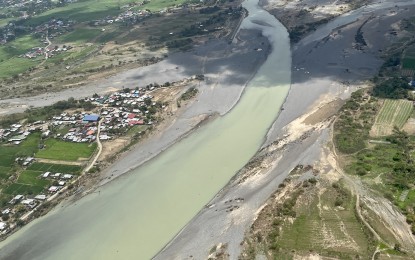 <p><strong>SILTED RIVER</strong>. Photo shows an aerial view of a massive river siltation in Ilocos Norte on Aug. 9, 2023 after typhoon Egay hit the province hard. In partnership with the Department of Environment and Natural Resources and private contractors, the provincial government wants all its river channels to restore their natural flows. <em>(PNA file photo by Leilanie G. Adriano)</em></p>
