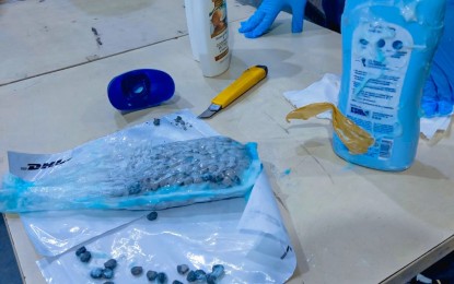 <p><strong>BUSTED.</strong> Customs officers discover PHP1.69 million worth of ecstasy tablets from a shipment inside the DHL Express Gateway Warehouse in Ninoy Aquino International Airport on Nov. 9, 2023. The BOC-NAIA on Monday (Nov. 13, 2023) said the shipment was subjected to a 100 percent physical examination as it yielded suspicious images after an X-ray scanning conducted by Customs officers. <em>(Photo courtesy of BOC)</em></p>