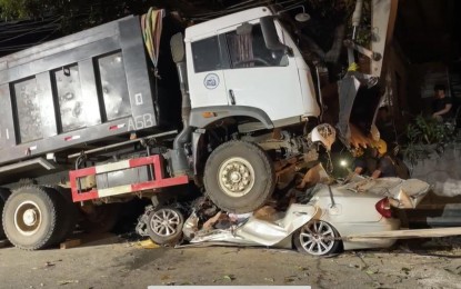 <p><strong>KILLER TRUCK:</strong>  Four people were killed when the car they were riding in was run over by a dump truck along the highway in Barangay New Cabalan, Olongapo City on Monday night (Nov. 12, 2023). The car went underneath the truck, making it hard to retrieve the victims’ bodies. <em>(Contributed Photo)</em></p>