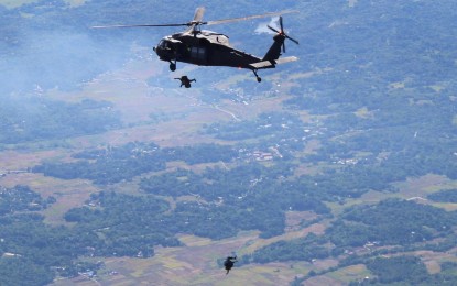 <p><strong>FREE-FALL DRILLS.</strong> A S-70i "Black Hawk" helicopter of the Philippine Air Force is seen here participating in a "military free fall simulation" exercise over Paoay, Ilocos Norte on Nov. 11, 2023. This is part of the field training exercises of this year's edition of the Armed Forces of the Philippines Joint Exercise Dagat-Langit-Lupa. <em>(Photo courtesy of the PAF)</em></p>