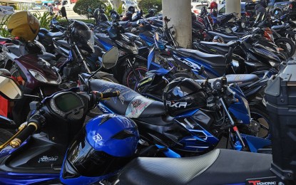 <p><strong>HELMET SAVES LIVES.</strong> Most motorcycles parked in one of the malls in Cagayan de Oro City on Wednesday (Nov. 15, 2023) have helmets on them. A City Councilor is pushing for the repeal of an ordinance that eases the use of helmet in certain areas in the city, following an accident that killed his son. <em>(PNA photo by Nef Luczon)</em></p>