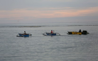 <p>Fishing boats in Masinloc, Zambales <em>(PNA file photo by Joan Bondoc)</em></p>