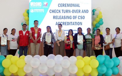 <p><strong>LIVELIHOOD AID.</strong> The Department of Social Welfare and Development in the Caraga Region turns over PHP14.2 million in livelihood grants to 32 associations in Siargao Island, Surigao del Norte on Thursday (Nov. 16, 2023) in Dapa municipality. The groups also received accreditation from the agency. <em>(Photo courtesy of DSWD-13)</em></p>
