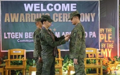 <p><strong>AWARDS.</strong> Visayas Command chief Lt. Gen. Benedict Arevalo pins a medal (left) on a soldier during a ceremony at the 303rd Infantry Brigade at the Camp Gerona in Murcia, Negros Occidental on Wednesday (Nov. 15, 2023). A total of 50 soldiers were pinned with medals in recognition of their peacebuilding initiatives in Negros Island. <em>(Photo courtesy of Viscom PIO)</em></p>