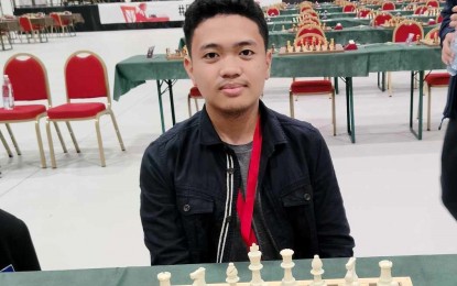 <p><strong>WINNER.</strong> Filipino FIDE Master Mark Jay Bacojo boosts his campaign at the FIDE World Youth Chess Championships with a victory in the fifth round at the Pala Dean Martin Centro Congressi in Montesilvano, Italy on Friday (Nov. 17, 2023). He bested French International Master Timothe Razafindratsima in 26 moves of the Sicilian Defense, Alapin Variation to claim his fourth victory against one loss. <em>(Contributed photo)</em></p>