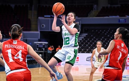 <p><strong>TOPSCORER</strong>. Lee Sario of De La Salle University aims for the basket during their game against University of the East in the UAAP Season 86 women's basketball tournament at Mall of Asia Arena in Pasay City on Sunday (Nov. 19, 2023). Sario had 18 points, seven rebounds and four assists as the Lady Archers beat the Lady Warriors, 58-45, to end their campaign at 7-7. <em>(UAAP photo)</em></p>
