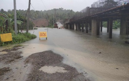 <p><strong>IMPASSABLE.</strong> A flooded road in Arteche, Eastern Samar in this Nov. 20, 2023 photo. Several local government units in Eastern Visayas suspended classes on Monday as incessant rains caused flooding in low-lying communities. <em>(Photo courtesy of DPWH Eastern Samar)</em></p>