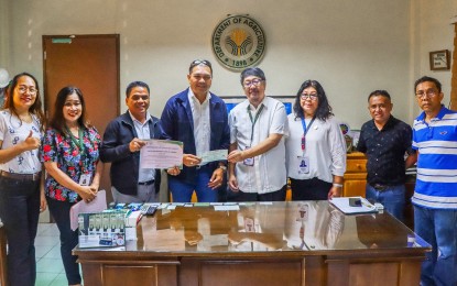 <p><strong>QUALITY FARM PRODUCTS</strong>. Vice Mayor Harvey Manawatao (4th from left) of Carmen, Surigao del Sur receives on Monday (Nov. 20, 2023) the PHP3.8 million financial grant from the Department of Agriculture in the Caraga Region, represented by executive director Ricardo Oñate (5th from left). The grant, released under the Enhanced Kadiwa Financial Grant Assistant Program, will be used to buy transport vehicles to deliver farm products to market centers.<em> (Photo courtesy of DA-13)</em></p>