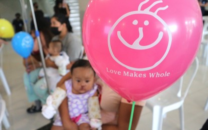 <p class="p1"><span class="s1"><strong>PRECIOUS SMILE.</strong> A baby about to undergo cleft palate surgery is given a balloon with a smiley, at the UniDav Hospital in Davao City on Thursday (Nov. 23, 2023). The life-changing surgery was facilitated by the Noordhoff Craniofacial Foundation, Inc. of Taiwan. <em>(PNA photo by Robinson Niñal Jr.)</em><br /></span></p>