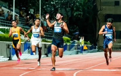 <p><strong>GOLDEN FINISH</strong>. University of the Philippines sophomore Alhryan Labita (No. 705) rules the men's 200-meter dash in record-breaking fashion in the UAAP Season 86 athletics competition at PhilSports track oval in Pasig City on Thursday (Nov. 23, 2023). Labita set a new UAAP record of 21.42 seconds for his second gold after defending his 100m title, also in record-breaking finish. <em>(Photo courtesy of UAAP)</em></p>