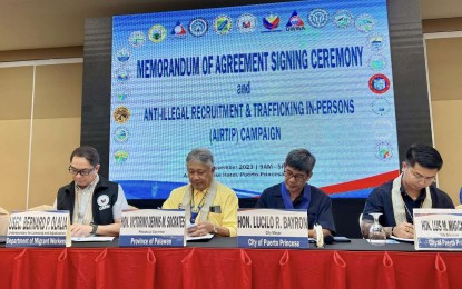 <p><strong>MOA SIGNING</strong>. The Deaprtment of Migrant Workers (DMW) signs a memorandum of agreement with 16 towns in Palawan to better protect overseas Filipino workers and their families.  The DMW hopes to replicate same agreement with various local government units in the country to effectively curb illegal recruitment and human trafficking. <em>(Photo courtesy of DMW) </em></p>