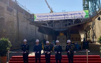 <p><strong>CONSTRUCTION BEGINS.</strong> Philippine Navy (PN) chief Vice Adm. Toribio Adaci Jr. (center) graces the keel laying rites and steel cutting rites for the PN's two missile corvettes at the HD Hyundai Heavy Industries shipyard in Ulsan, South Korea on Nov. 22, 2023. The PN said these rites mark the start of the construction process of the two corvettes. <em>(Photo courtesy of HD HHI)</em></p>