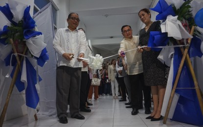<p><strong>NEW OFFICES. </strong>Department of Justice (DOJ) Undersecretary Raul T. Vasquez (left) leads in the ribbon cutting ceremony for the new human rights office and gender and development special protection office at the DOY office in Manila on Monday (Dec. 4, 2023). Both offices will focus on establishing what it hoped to be a human rights-centric justice system. <em>(PNA photo by Ben Pulta) </em></p>