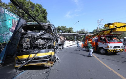 <p><strong>ROAD ACCIDENT.</strong> A trailer truck loaded with bag of cement hits an electrical post along Ortigas Avenue Extension in Antipolo City on Dec. 4, 2023. Transportation Office chief Assistant Secretary Vigor Mendoza II has ordered regional directors to strictly implement the crackdown on overloaded trucks and trailers.<em> (PNA photo by Joey O. Razon)</em></p>