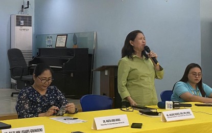 <p><strong>SAFE HOLIDAYS</strong>. Arlene Riario (center), National Nutrition Council (NNC) regional program coordinator for Bicol, answers questions during a press conference in Legazpi City on Tuesday (Dec. 5, 2023). The Department of Health-5 (Bicol) has urged the public to choose healthy food and to give safe and age-appropriate toys to children this Christmas season.<em> (PNA photo by Connie Calipay)</em></p>