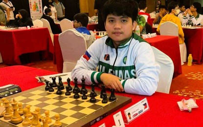 <p><strong>CO-LEADER</strong>. Filipino International Master Daniel Quizon poses for a photo during the Open division of the Eastern Asia Juniors and Girls Chess Championships at the Sabah Oriental Hotel in Kota Kinabalu, Sabah, Malaysia on Tuesday (Dec. 5, 2023). Quizon downed Dasmariñas Chess Academy teammate, FIDE Master Christian Gian Karlo Arca to share the lead with Mongolia’s FIDE Master Munkhdalai Amilal. <em>(Contributed photo)</em></p>